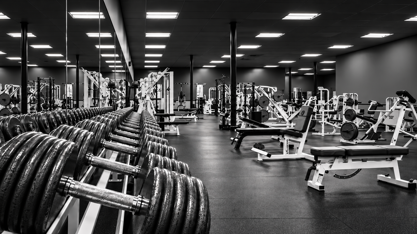 Wide view of the strength floor and equipment inside Legends Gym