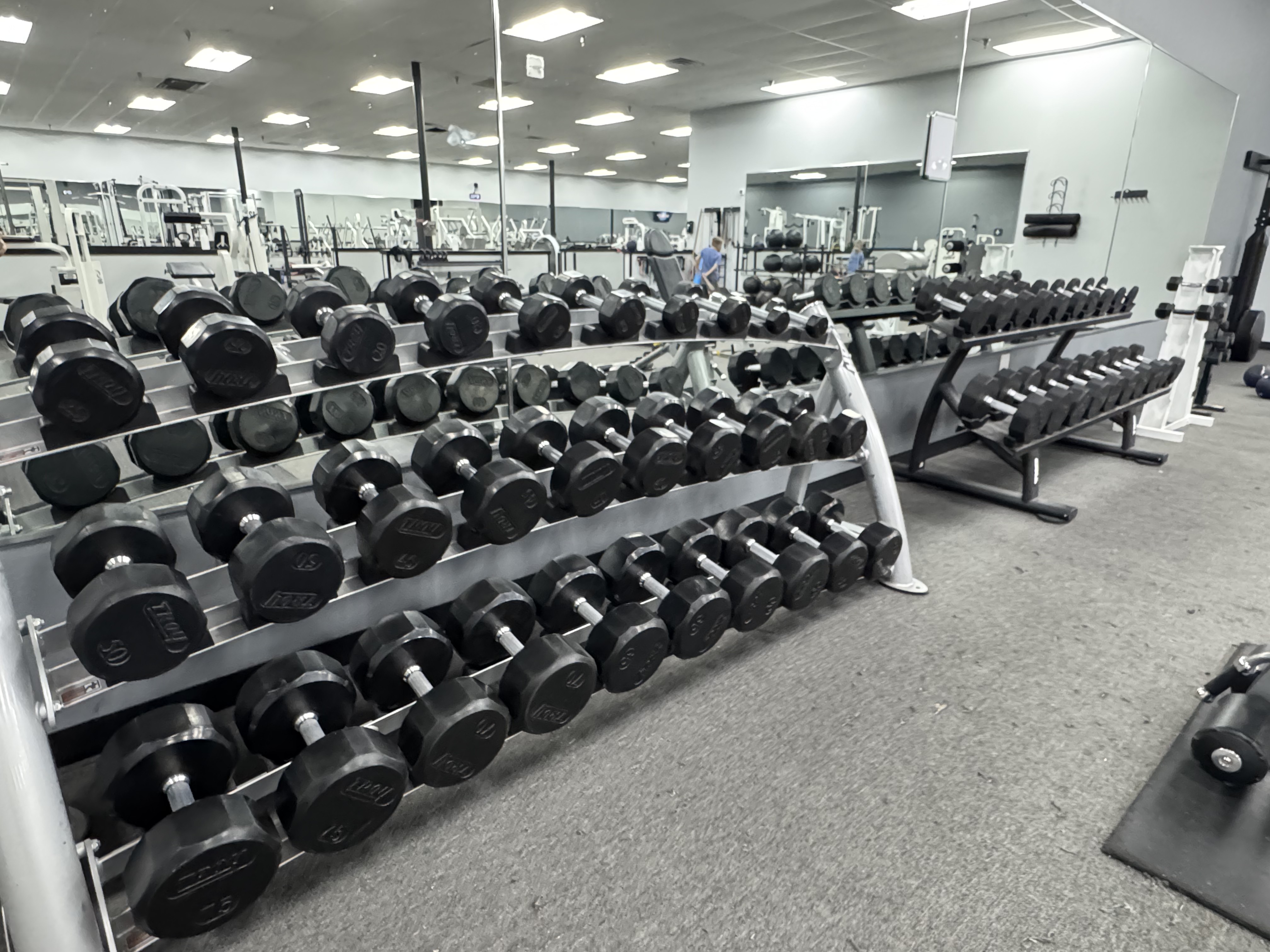 Dumbbell racks on the Legends Gym strength floor